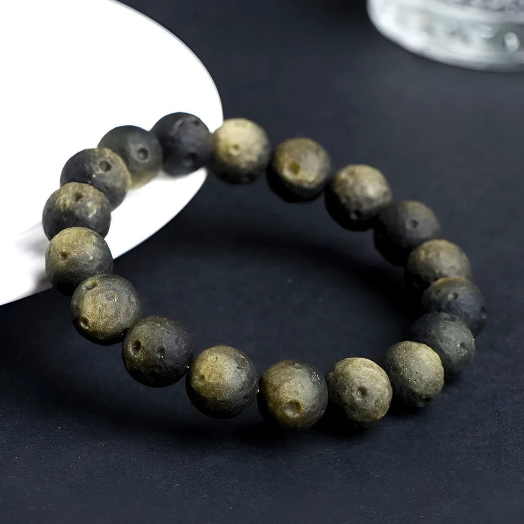 Natural obsidian crater ball bracelet with textured beads in silver meteorite finish