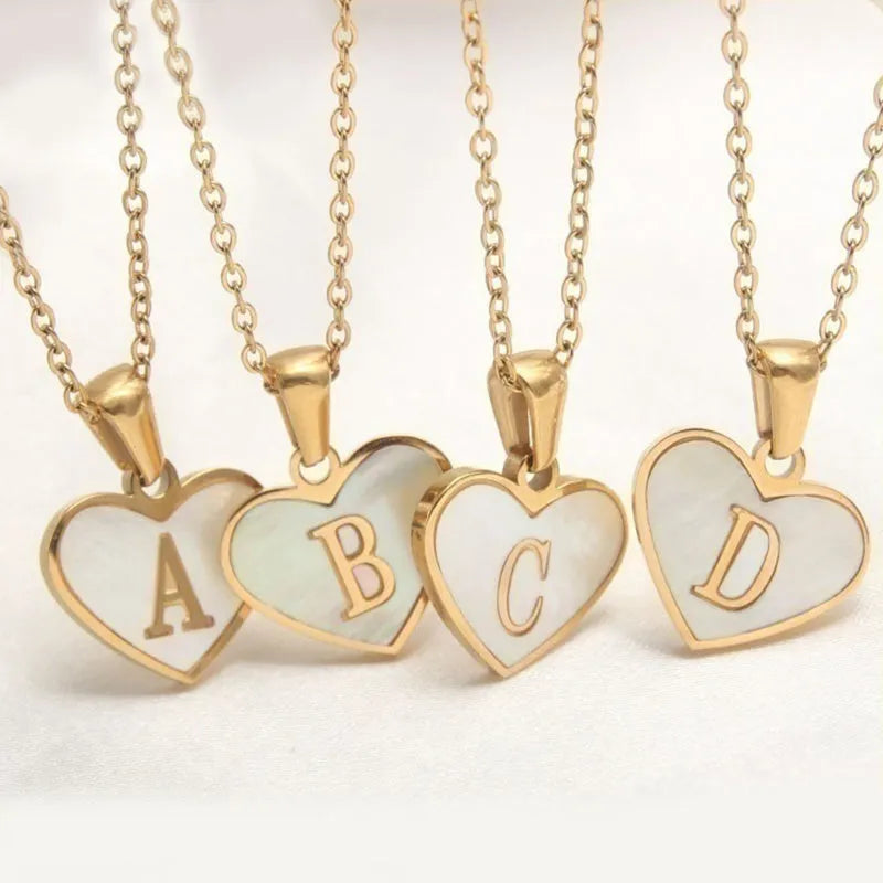Gold plated heart necklace with white shell detail on an adjustable chain