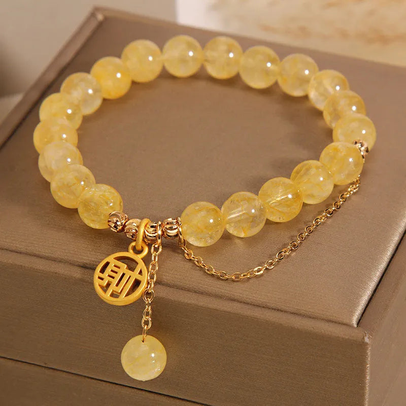 Adjustable natural citrine gemstone bracelet with selectable Chinese 'Cai' or 'Fu' character charm and tassel.