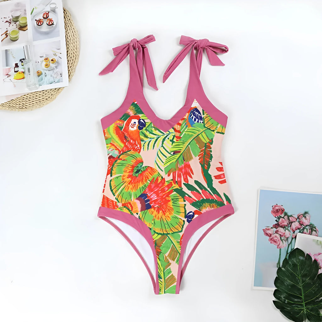 Retro pink floral print women's one-piece swimsuit with a V-neck, covered belly, and thin skirt.