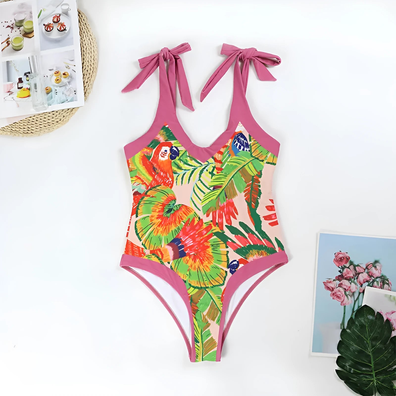 Retro pink floral print women's one-piece swimsuit with a V-neck, covered belly, and thin skirt.