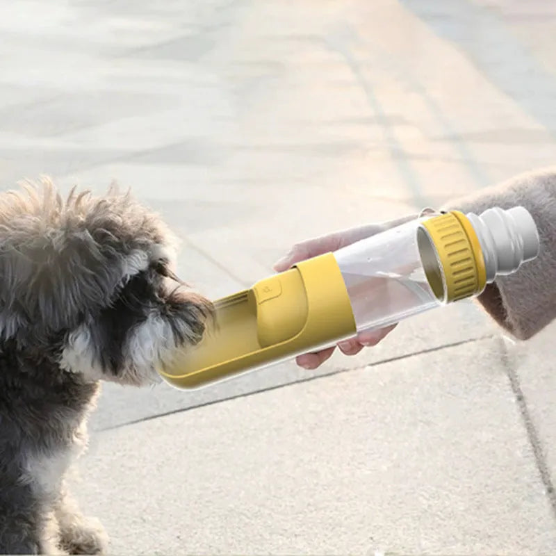 Dark blue portable dog water bottle with integrated drinking bowl, shown with leak-proof cap.