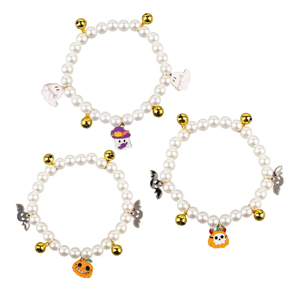 Halloween cat collar decoration with simulated pearls in purple ghost, skull, and smiling pumpkin designs.