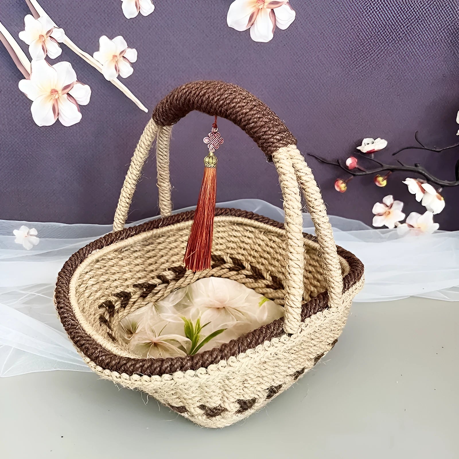 Coffee brown hand-woven straw basket with hemp rope detailing.