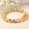 Citrine crystal bracelet with 10mm spherical beads on wrist