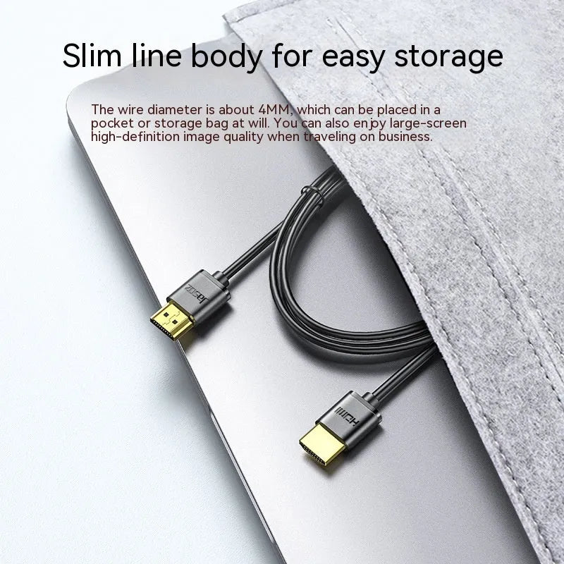 A thin, flexible black HDMI cable with gold-plated connectors on a white background.