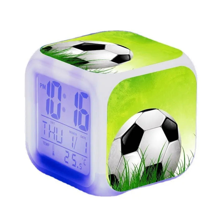 Cartoon football pattern silent alarm clock for children on a desk.