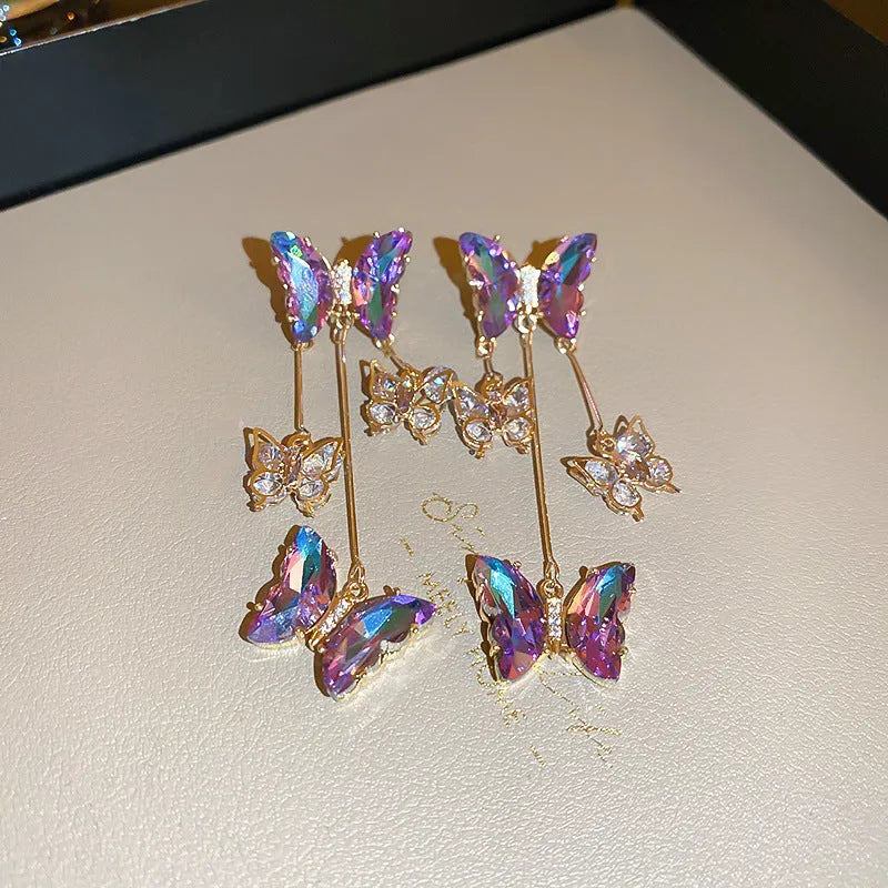 Silver needle crystal flowers butterfly tassel earrings in blue purple colour on alloy hooks