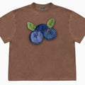 Loose fit blueberry patchwork t-shirt in ice oxygen cotton, showing short sleeves and round neck.