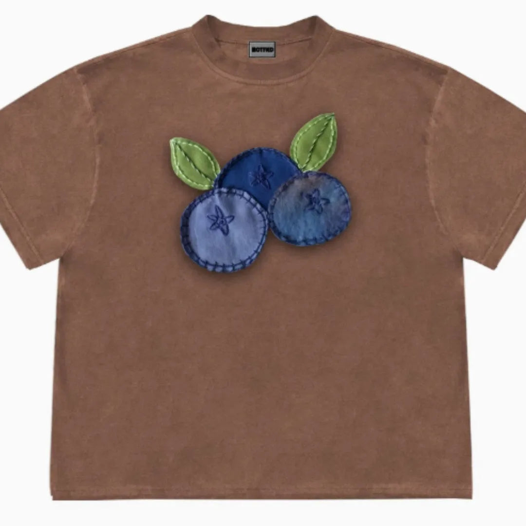 Loose fit blueberry patchwork t-shirt in ice oxygen cotton, showing short sleeves and round neck.