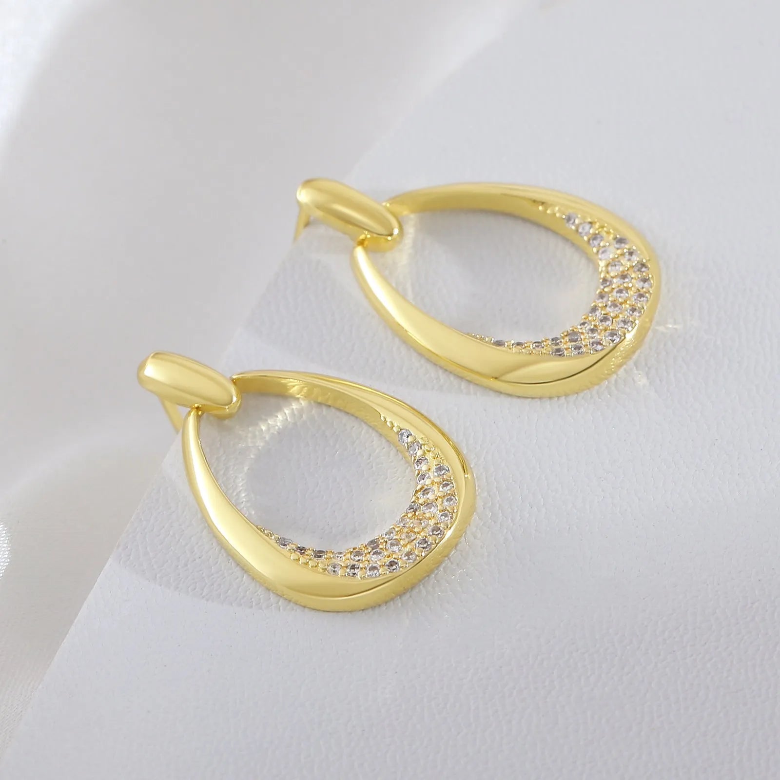 Yellow gold geometric drop-shaped women's earrings with a simple design.