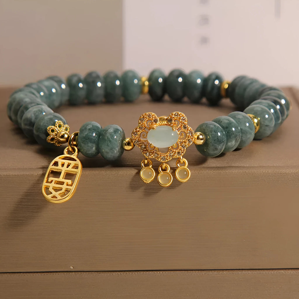 Women's natural emerald jade bracelet with alloy construction showing abacus bead design and safety lock closure