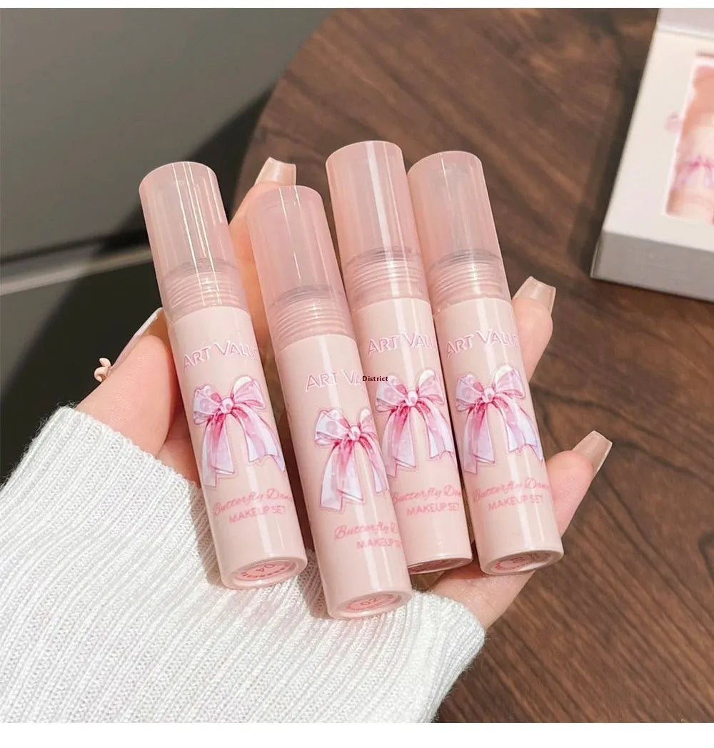 Butterfly box makeup set containing four matte lip muds, powder blusher, and coordinating necklace