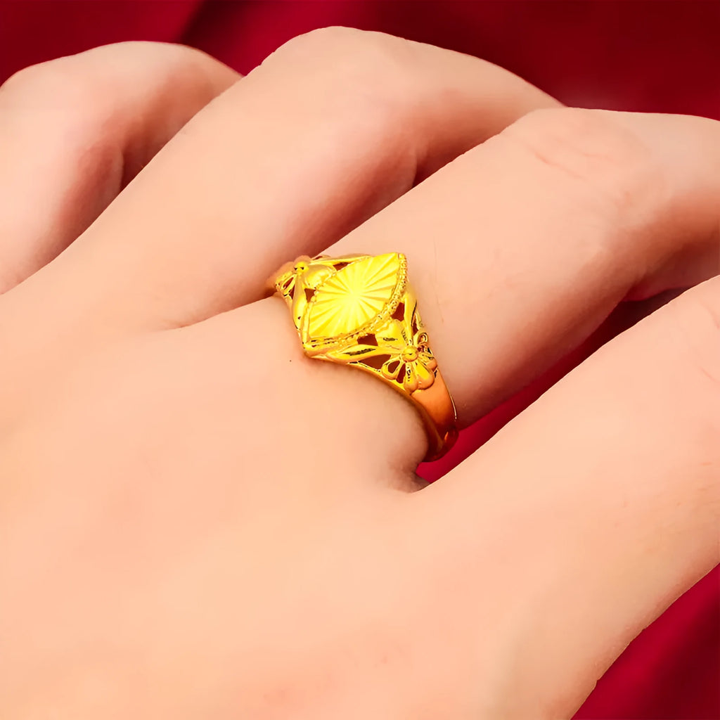 Geometric gold flower ring with open setting and textured details on brass base