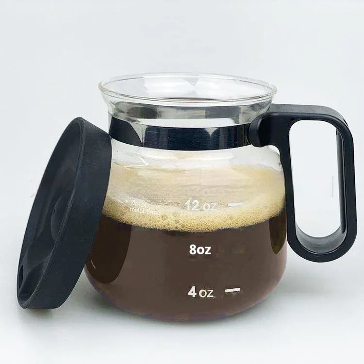 Transparent borosilicate glass French press coffee maker with stainless steel plunger and a black silicone cover.