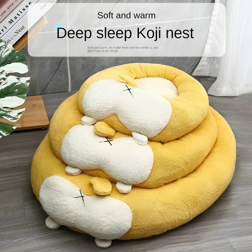 Corgi-shaped plush pet bed for dogs and cats in grey, shown in a home setting.