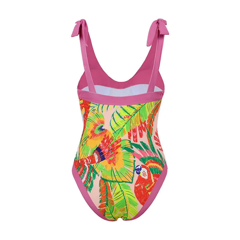 Retro pink floral print women's one-piece swimsuit with a V-neck, covered belly, and thin skirt.