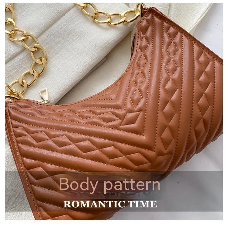 Brown pleated chain strap baguette shoulder bag with a vertical square shape and soft carry handle.