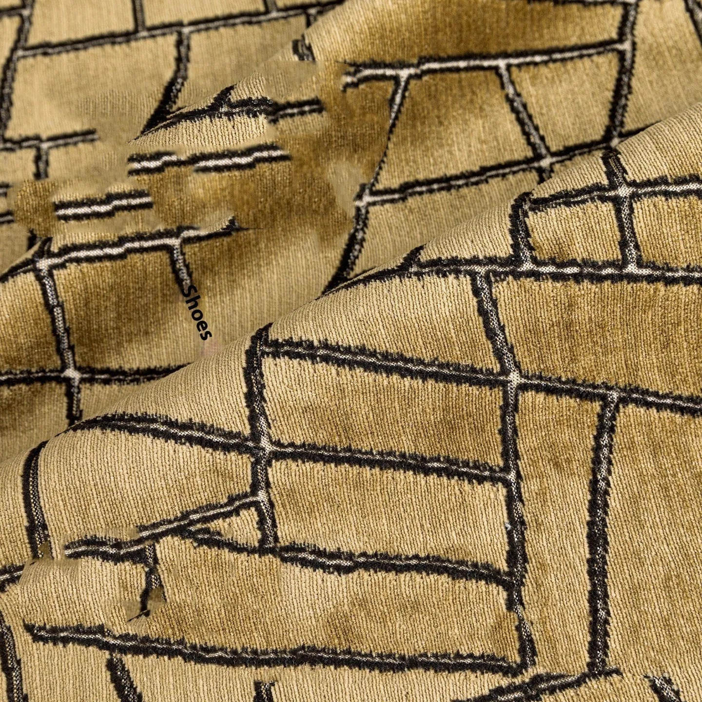Gold geometric abstract pattern on a square polyester cushion cover and a lumbar pillow.