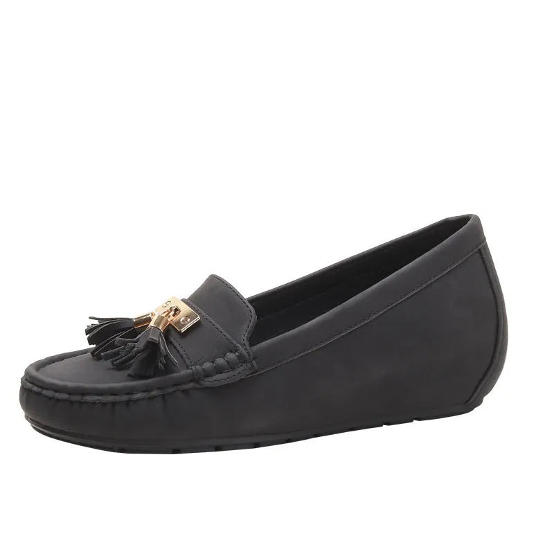 Nude coloured heel height increasing insole with round toe for flat shoes.