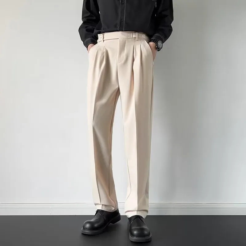 Man wearing apricot coloured straight-leg loose-fit suit pants made from polyester fibre.