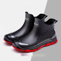 Pair of solid colour low tube PVC wading shoes with a round toe and non-slip plastic sole.