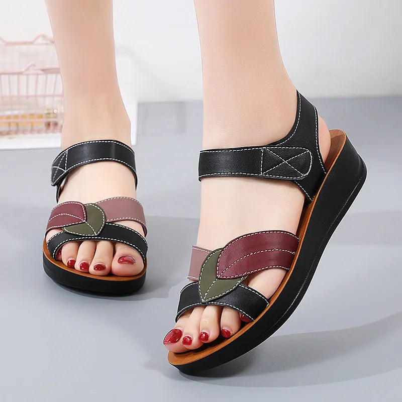 Women's thick-soled Velcro sandals in beige with side hollow design and colour blocking on a flat surface