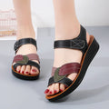 Women's thick-soled Velcro sandals in beige with side hollow design and colour blocking on a flat surface