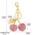 Zinc alloy cherry-shaped keychain pendant in red or pink colour