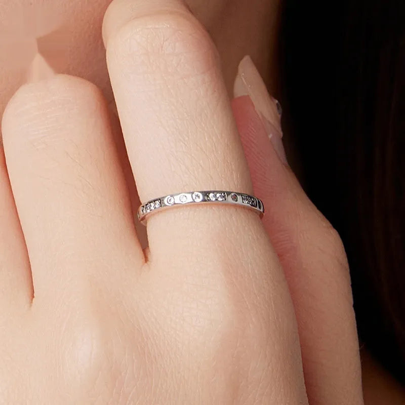 Oxidised black silver ring with Moss Password I Love You design on a simple band.