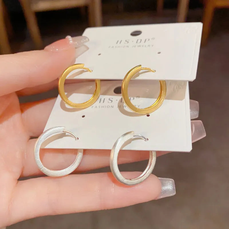 Copper geometric ear clips with gold plating in gold and silver colour options