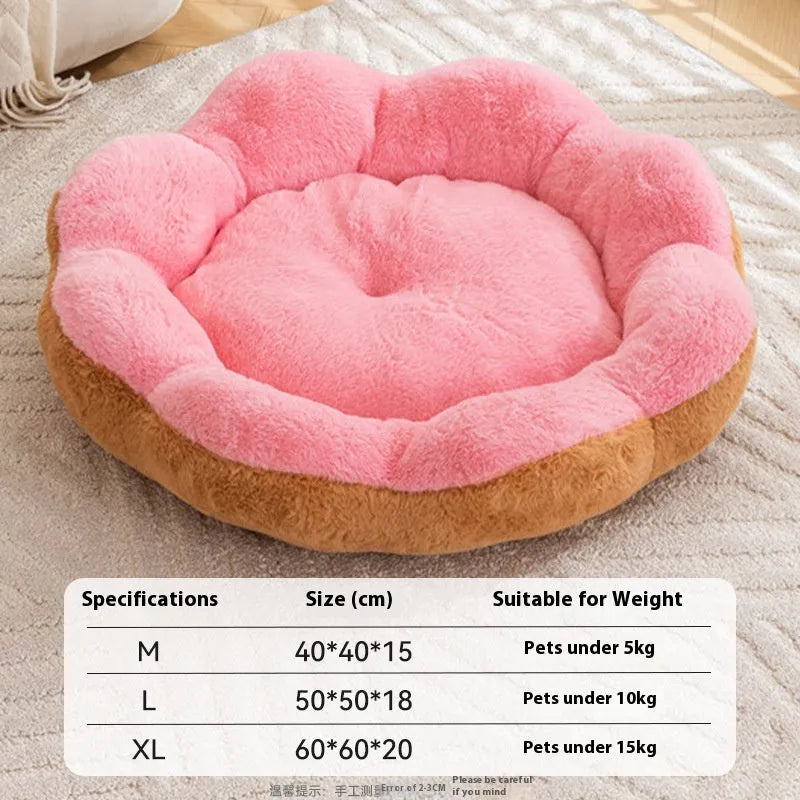 A round, thick plush cat bed with a removable cover shown in a two-tone colour, placed next to a cat toy.