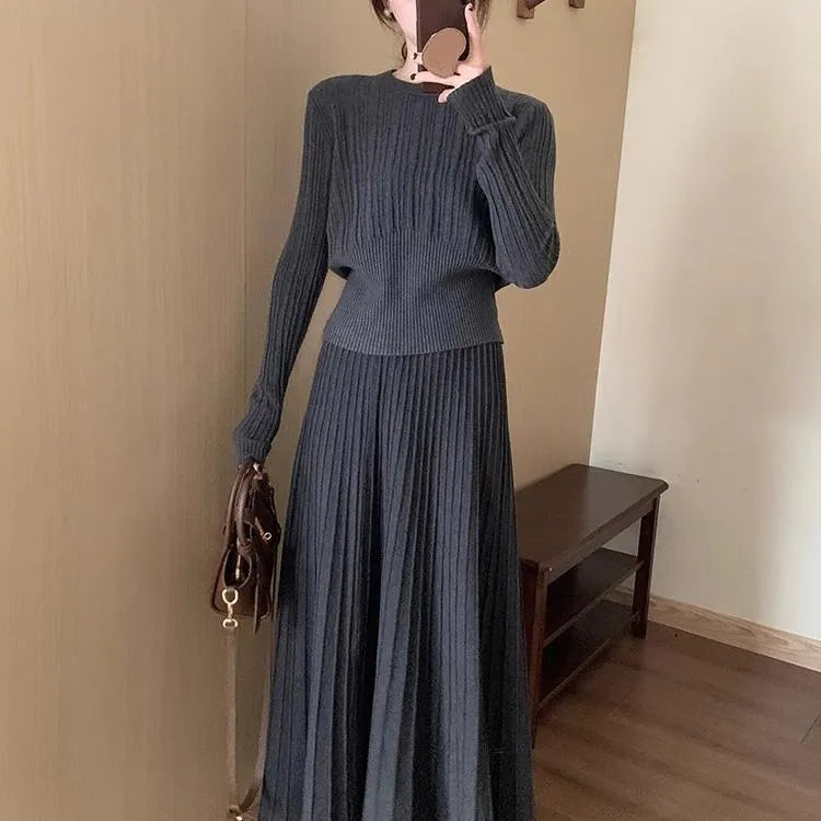 Dark grey knitted long dress suit with 3D texture, featuring a sweater and skirt in artistic retro style.