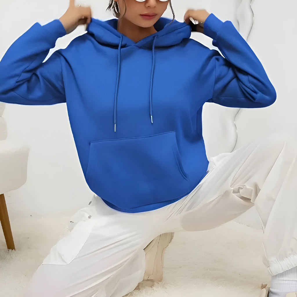 Women's loose grey drawstring pocket sweatshirt with long sleeves on a hanger.