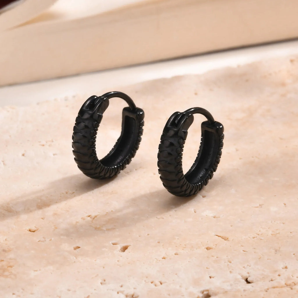 Stainless steel snake pattern hip hop earrings in black or gold with curved bar design