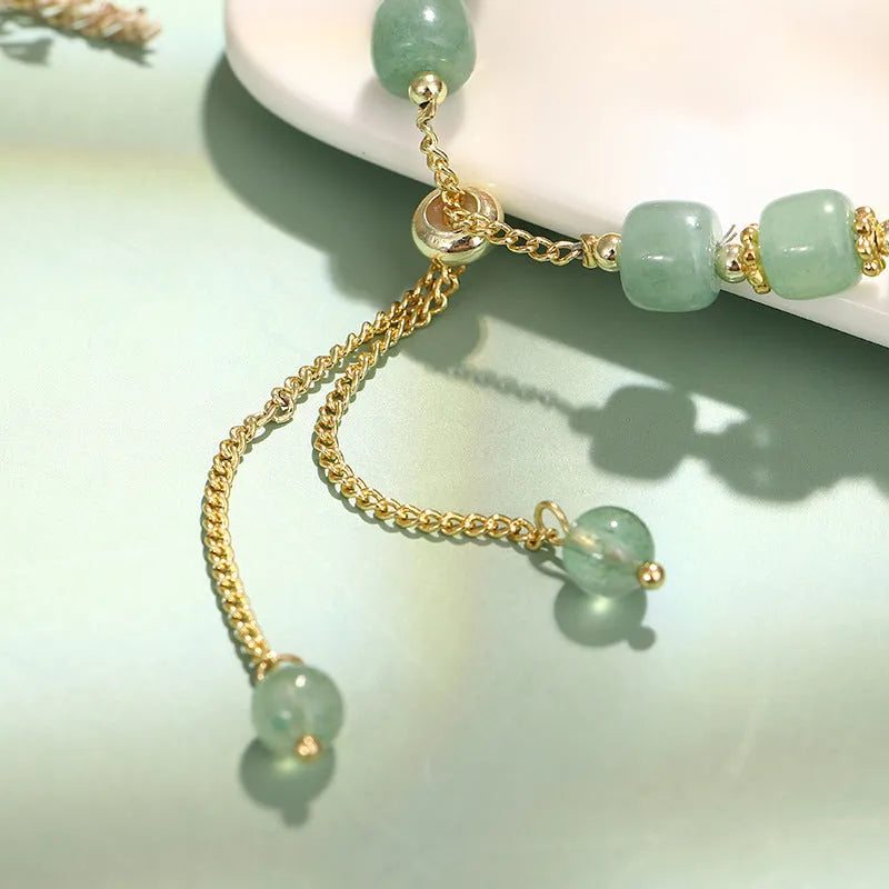 Natural stone rabbit bracelet with green aventurine and strawberry quartz beads, copper plating and gold accents