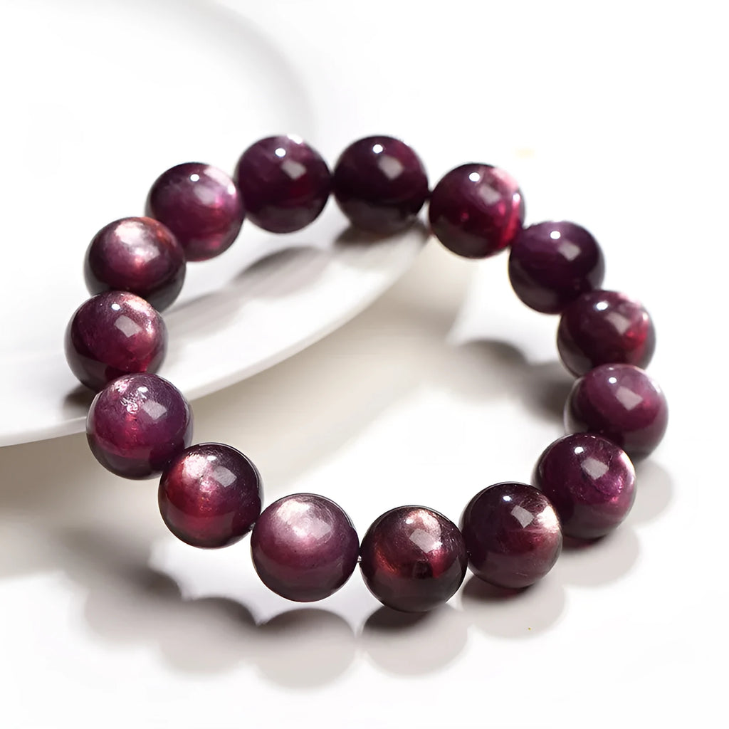 Purple lepidolite polished crystal round bead bracelet on a wrist, showing single circle design.