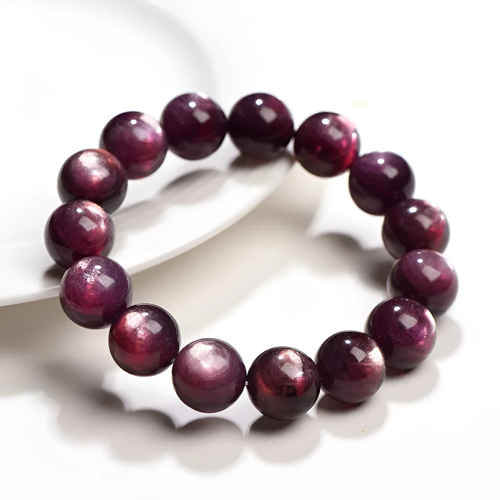 Purple lepidolite polished crystal round bead bracelet on a wrist, showing single circle design.