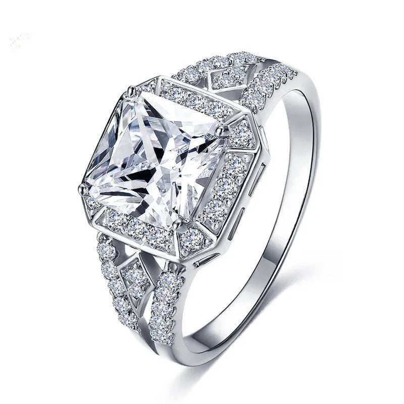Women's geometric hollow zircon ring in platinum colour showing quadrilateral design and inlaid stones