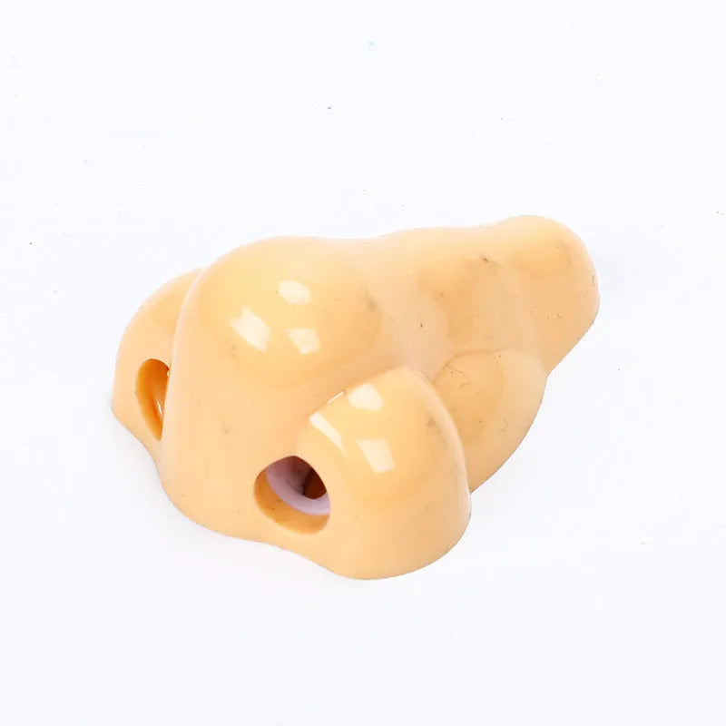 Flesh colour plastic pencil sharpener with geometry shape measuring 58×45×30mm for student stationery