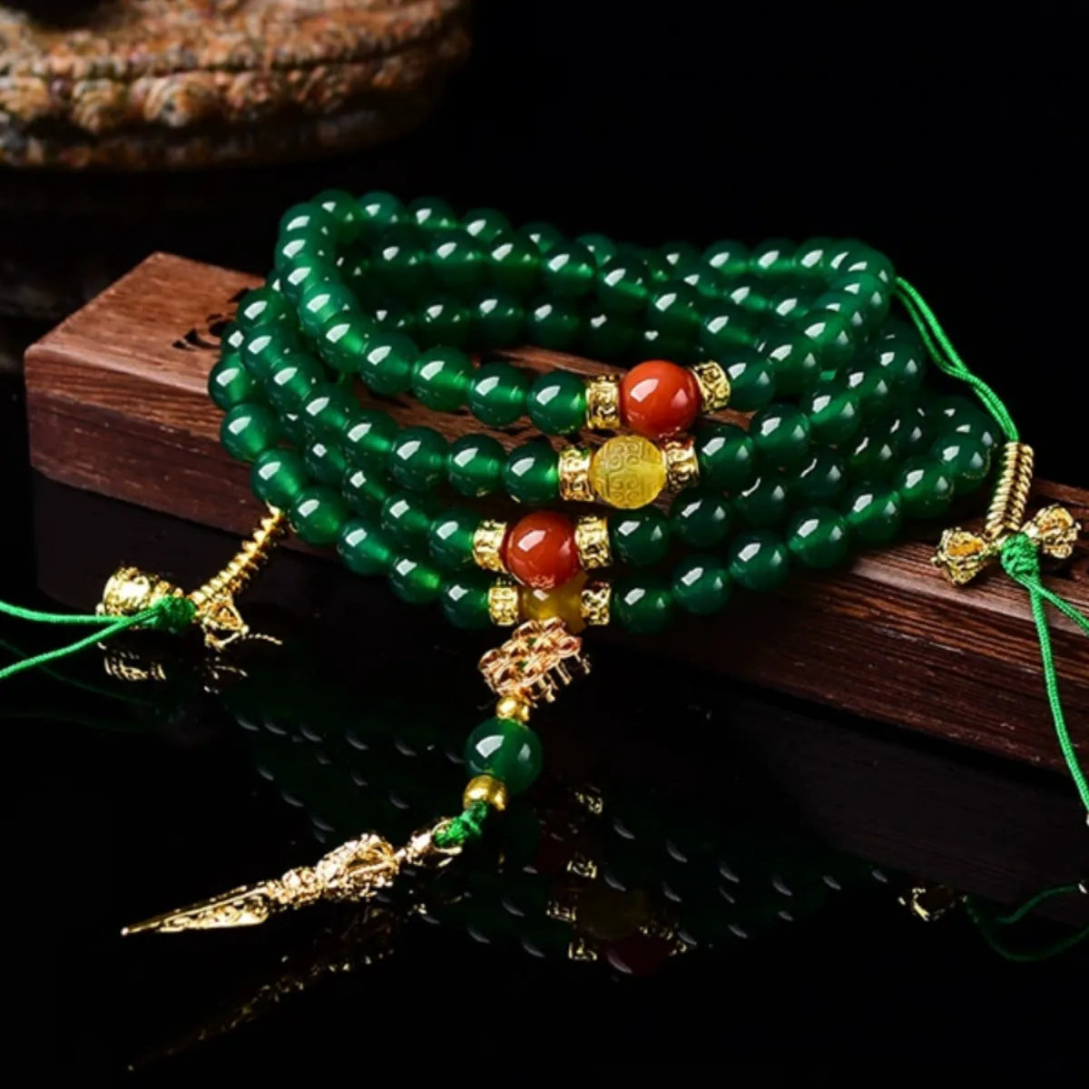Brazilian green agate multi-strand bracelet showing different bead sizes on a wrist.