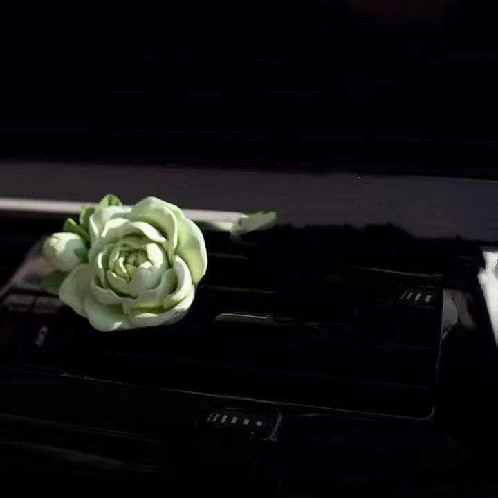 Jasmine scent solid gypsum car air vent perfume clip in beige white or fresh green.