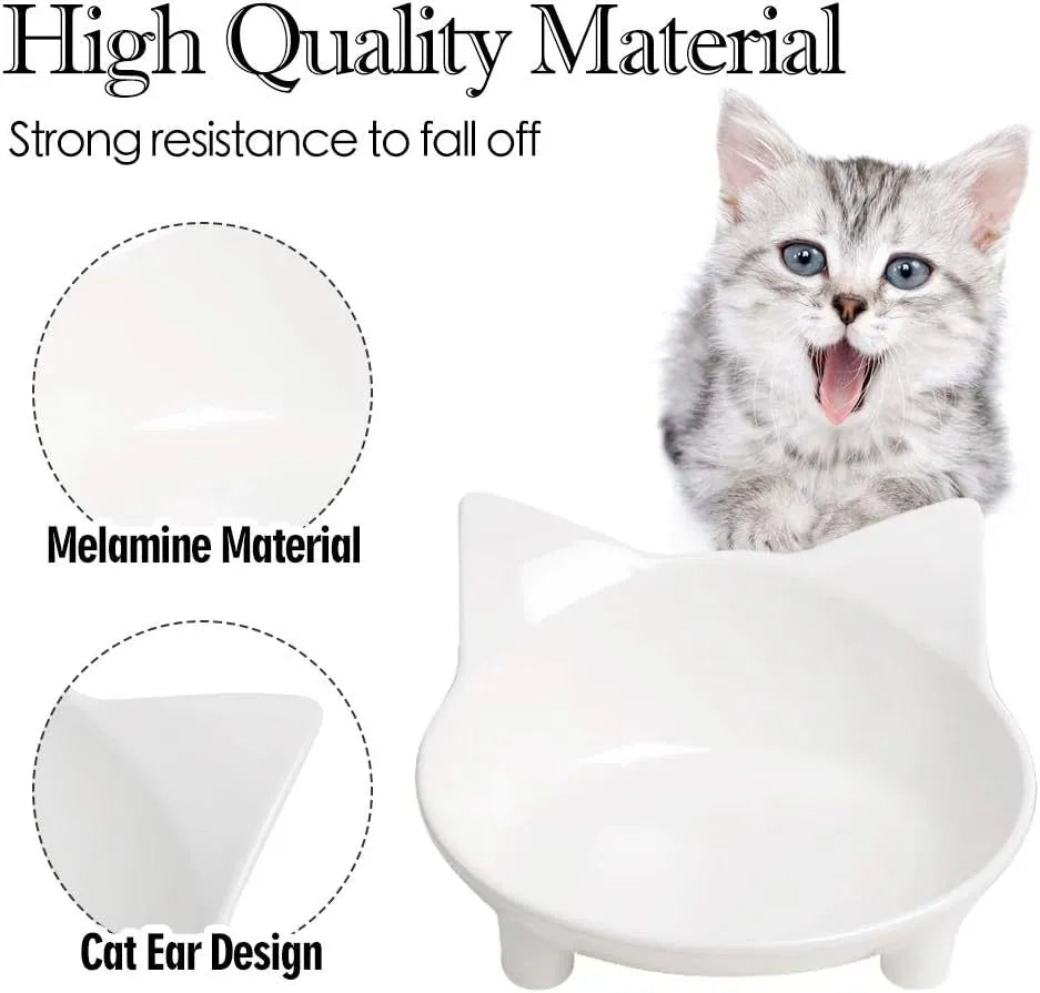 Shallow black or white melamine cat bowl with a non-slip rubber base on a table.
