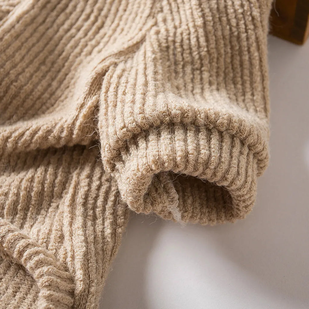 Brown cloth pullover sweater on a small dog, showing casual style.
