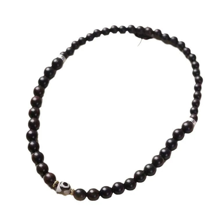 Ebony Tibetan bracelet with two circular beads in 8mm unisex sizing