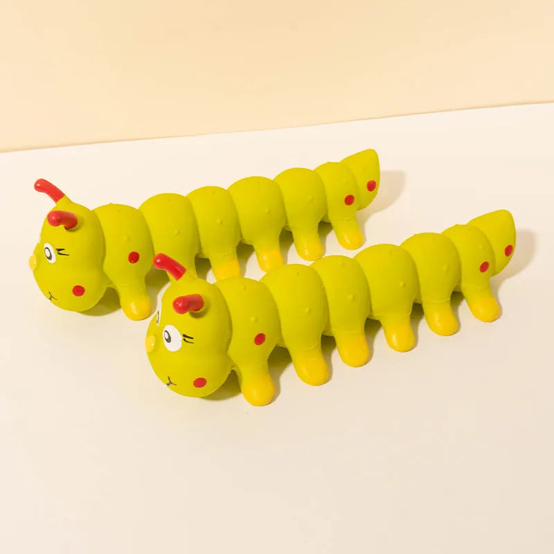 Yellow caterpillar-shaped rubber squeaky dog toy measuring 25.5cm long