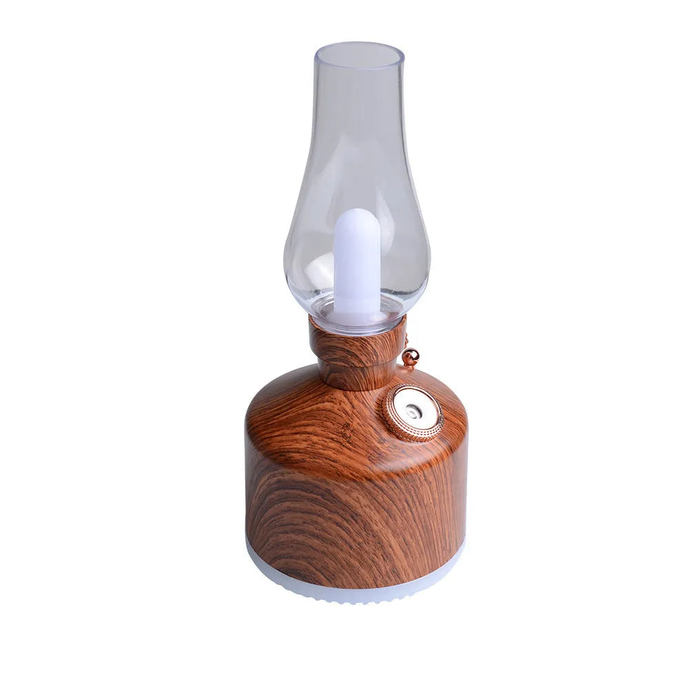 Kerosene lamp ultrasonic humidifier and aroma diffuser with ABS shell in brass color on a table