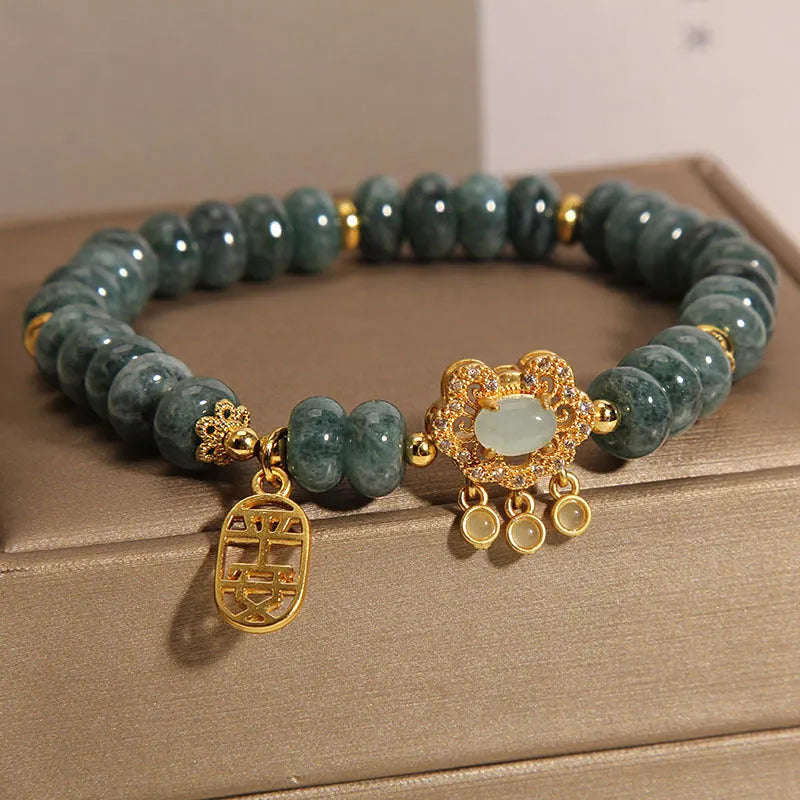 Women's natural emerald jade bracelet with alloy construction showing abacus bead design and safety lock closure