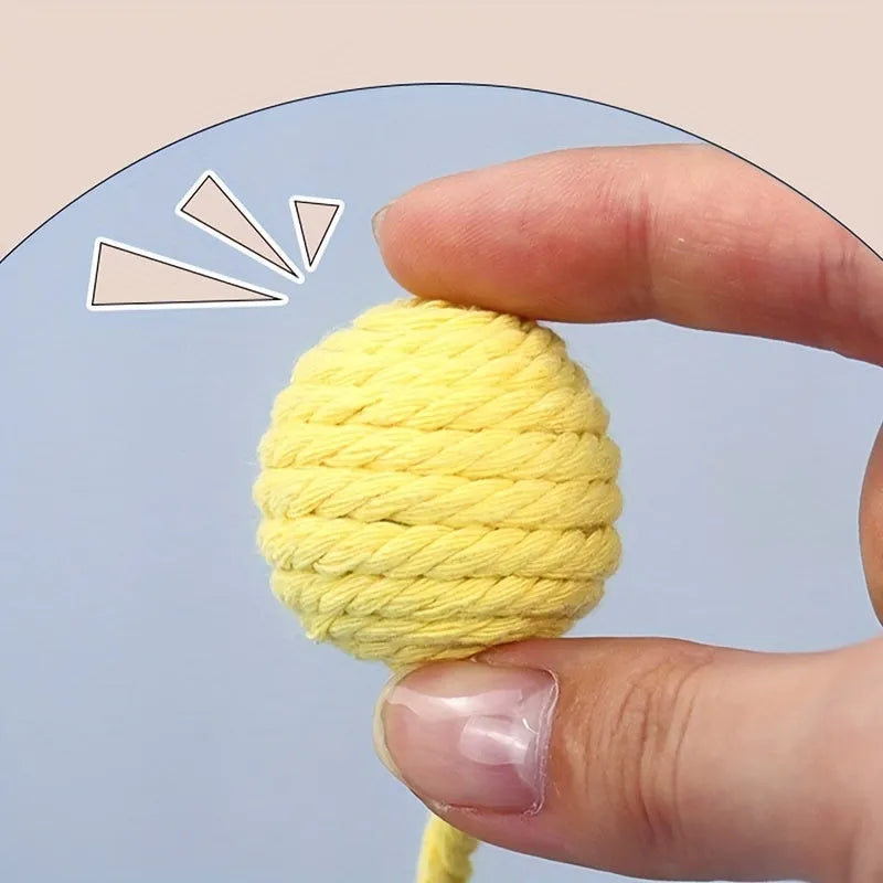 Colourful cat toy ball with rope handle and internal bell in small and medium sizes