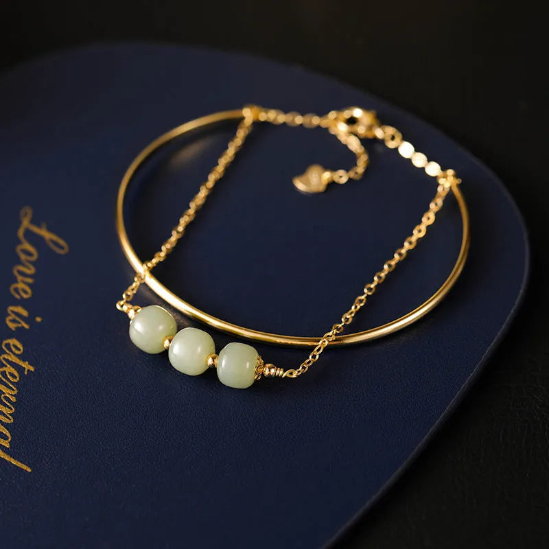 Jade lucky beads bracelet for women with gold inlay detailing showing single, double and three beads versions